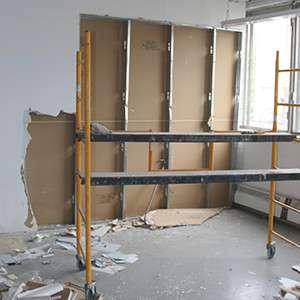 Demolishing a wall in an industrial office